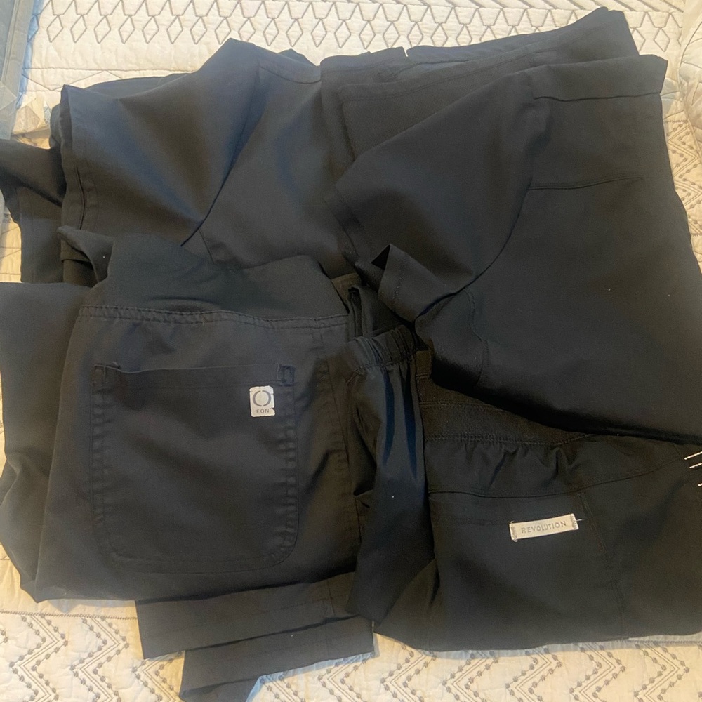 2 pair of black scrubs.